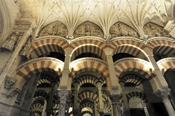 La Mezquita, Mosque, Cathedral of Cordoba, Cordoba, Andalusia, Spain, Europe, Interior view with red and white arches, decorative patterns and historical architecture, Europe