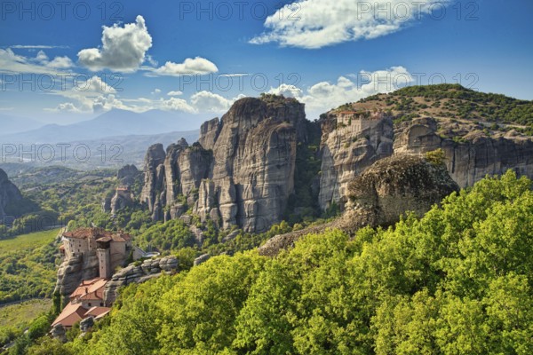 Monastery of Varlaam, Holy Monastery of Saint Nicholas, Monastery of Rousanou and Megalo Meteoro photographed on a sunny day. Edited with Luminar