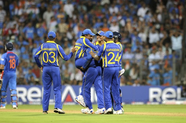 Sri Lankan player 2L Mahela Jaywerdena leaps wicket batsman Virat Kohli L ICC Cricket World Cup Wankhede Stadium Mumbai