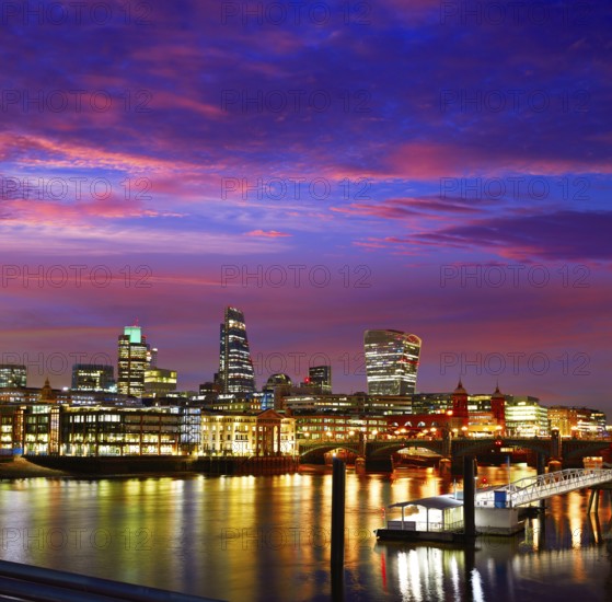 London skyline sunset on Thames river reflection at UK