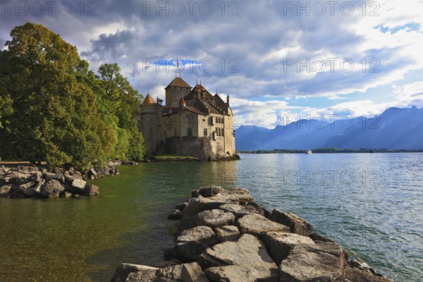Lake in the mountains. Cold sunset Lake Geneva in the fall on sunny day. Montreux, Switzerland, Europe