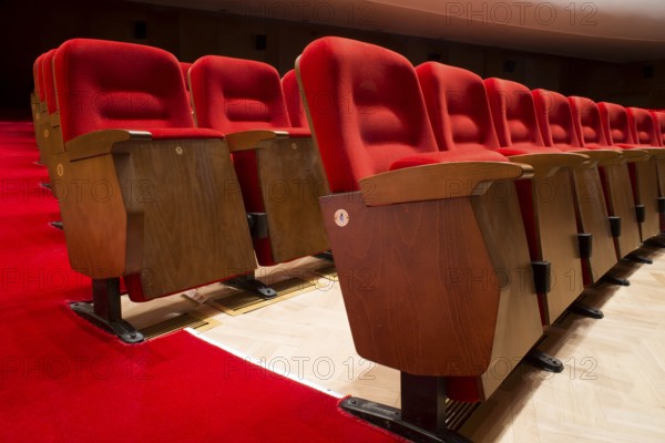 Red seats in a theater and opera