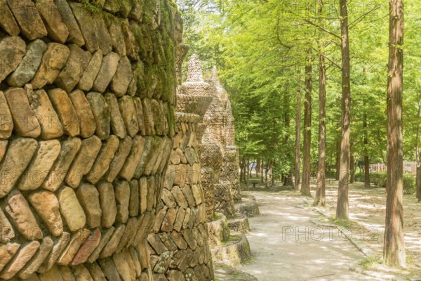 Daejeon, South Korea, August 16, 2020: Large intricately designed brick structures beside hiking trail in Sangso Dong recreational forest park, Asia