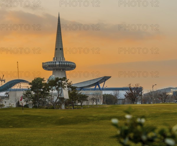 Daejeon, South Korea, December 23, 2019: Space needle at Expo Park behind exhibition buildings at sunset, Asia