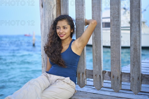 Mexican latin woman relaxed at Caribbean sea of Riviera Maya in Mexico