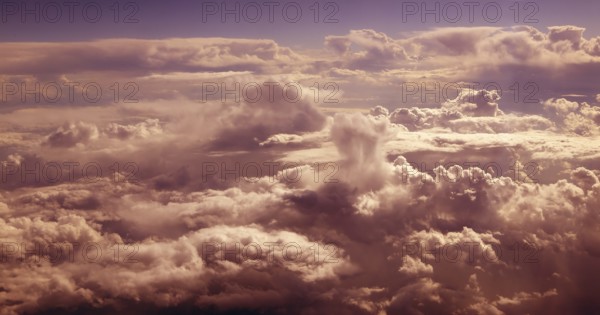 Orange cloudy sky aerial view from aircraft airplane