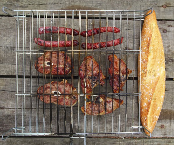 Barbecue sausages lamb meat grill bread on wooden table