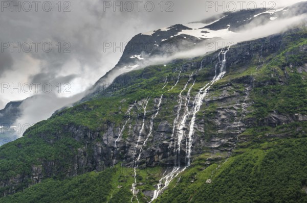 The Kjenndalsbreen is part of the Jostedalsbreen, one of the largest glaciers in Norway, and forms an impressive mountain landscape with a beautiful lake in Sande. The glacier Kjenndalsbreen with a lake in Norway is a beautiful place to travel to in summertime