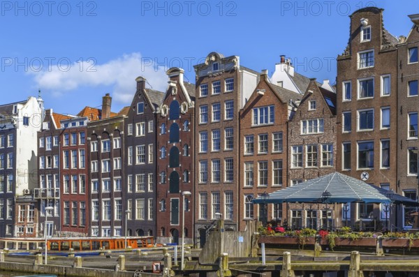 The so-called dancing house on the canal Damrak in Amsterdam, Netherlands