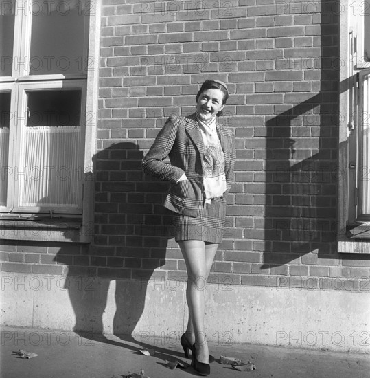 Nylon stockings in the 1950s. The model Solveij Nyhlén pictured outside the swedish factory of nylon stockings, Malmö strumpfabrik. Established 1926 and became the leading manufacturer of silk stockings in sweden. At this time 1951 the company had invested in new machinery to make the popular nylon stockings. Ref BE20-3