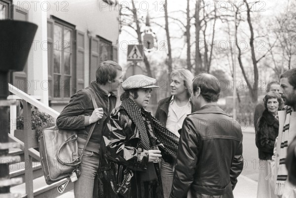 Elton John. English singer, songwriter born march 25 1947. Pictured wearing a chequered cap and a matching chequered scarf during a visit to Sweden 1978. Kristoffersson