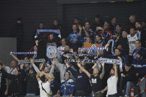 The travelling Ingolstadt fans celebrate the 6:3 victory in Schwenningen after the game of the DEL 24-25, Sptg. 5: Schwenninger Wild Wings vs ERC Ingolstadt, Villingen-Schwenningen, Germany / Germany