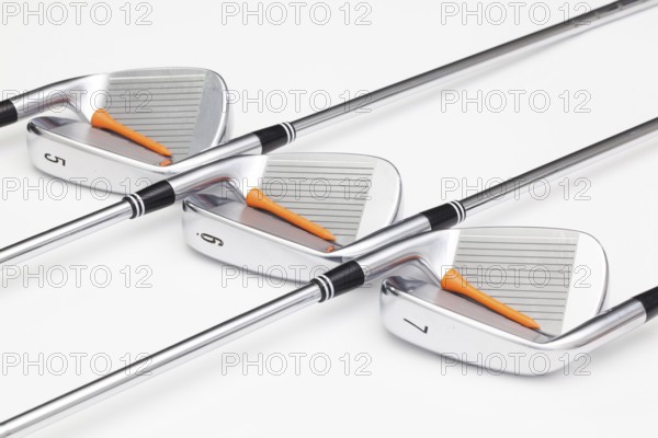 Titanium golf clubs on the white background