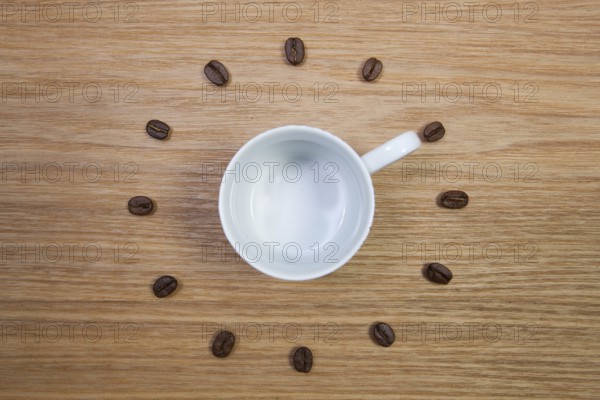 Coffee Time - Empty coffee cup and clock of coffee beans