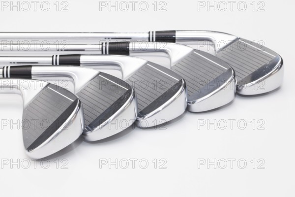 Titanium golf clubs on the white background