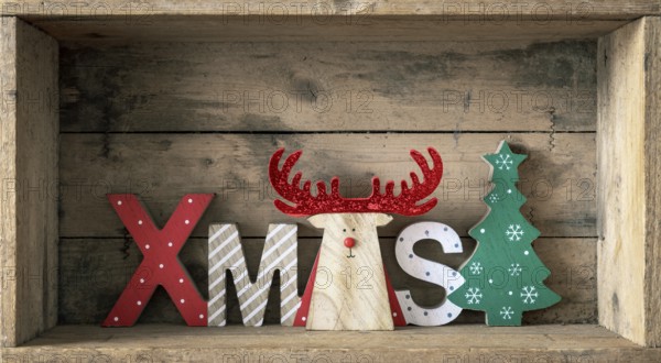 A wooden reindeer with xmas text in a wooden box Christmas symbols decoration