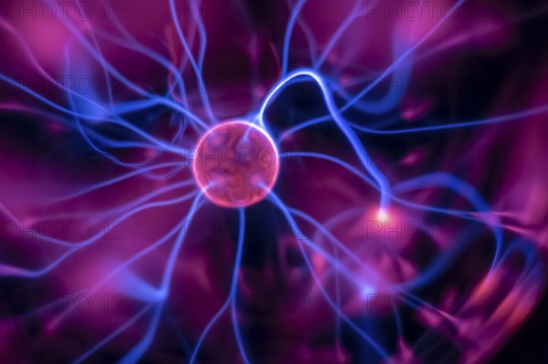 An image of a plasma lamp with moving light beams