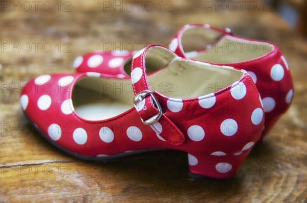 Red dance shoes with white dots