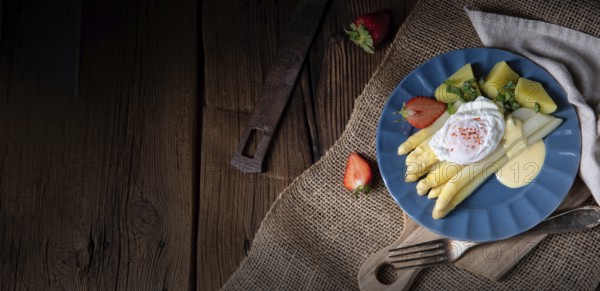 Boiled asparagus with egg and potatoes