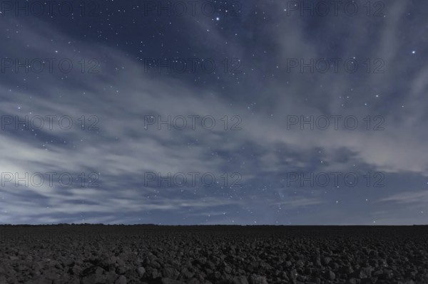 Cloudy Night sky with stars. Night background. Night sky