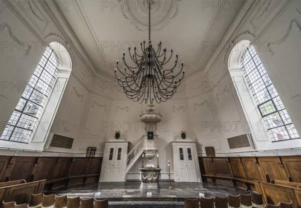 Monschau Old Town, North Rhine-Westphalia, Germany, 08 27 2019 Interior design of the Catholic church with a chandelier, Europe
