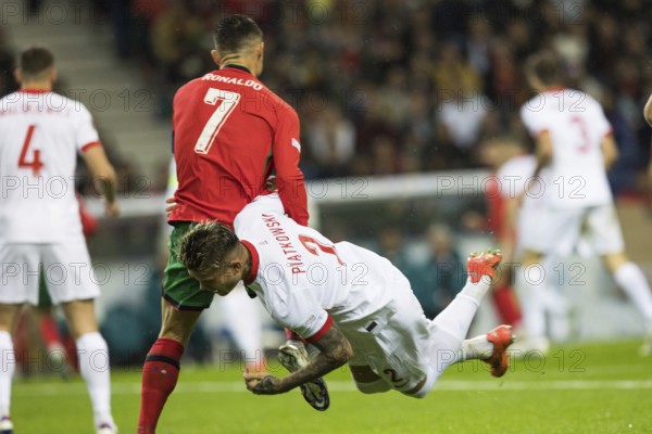 Football match, captain Cristiano RONALDO CR7 Portugal left looking from behind in a duel with Kamil PIATKOWSKI Poland he fouls him, Kamil PIATKOWSKI Poland right is literally screaming in the air, Estadio do Dragao, Porto, Portugal, Europe