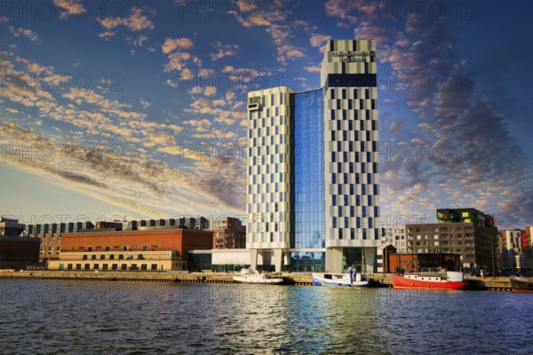 View of Hietalahti seafront with Clarion Hotel and city buildings at dusktime. Helsinki, Finland. March 27, 2020