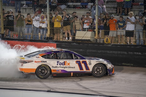 NASCAR Cup Series Driver Denny Hamlin (11) celebrates his win for the Bass Pro Shops Night Race at the Bristol Motor Speedway in Bristol TN