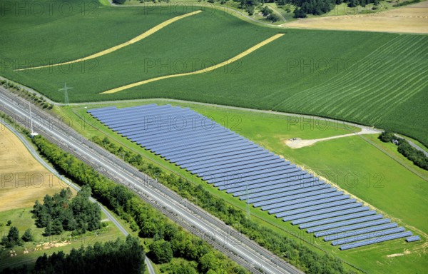 Solar system, embedded in a green field