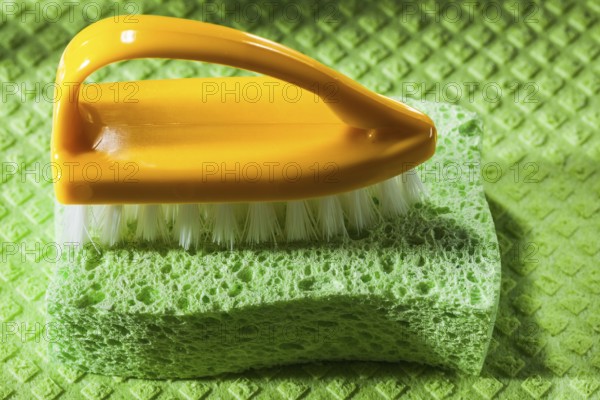 New plastic brush sponge on dishcloth