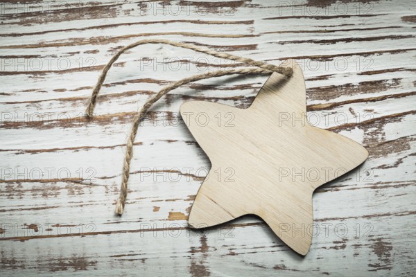 Vintage wooden star string on wood board celebrations concept