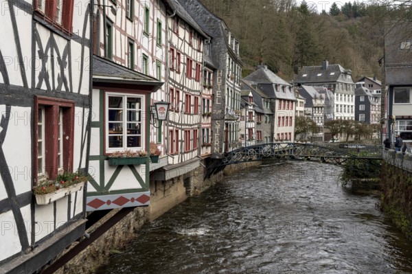 City Monschau in Region national park Eifel. Old town with old houses and river Rur