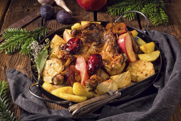 Chicken pieces with fruit and vegetables from the oven