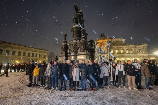 On 13 and 14 February 1945, Dresden was heavily destroyed in three Allied bombing raids. Every year, the people of Dresden commemorate this event at various events. A long human chain symbolises the protection of the city centre. Human chain on Theatre Square, Dresden, Saxony, Germany, Europe