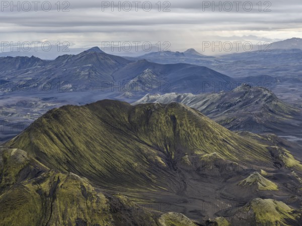 View from Mount Sveinstindur, volcanic landscape, moss-covered hills, mountains, Icelandic highlands, Iceland, Europe