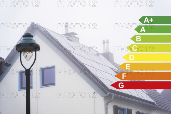 Solar panels on the roof of a detached house in the fog, energy efficiency classes according to the GEG, Düsseldorf, Germany, Europe