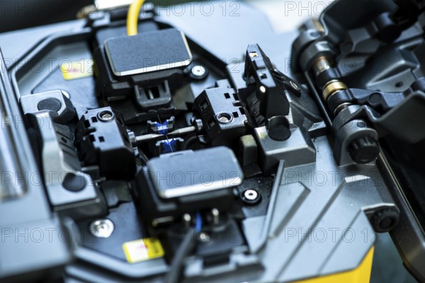 Device for mounting optical cable. Optical internet Technology concept. Optical fiber assembly