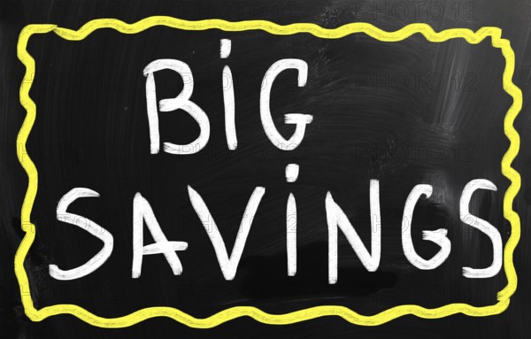 Big savings handwritten with white chalk on a blackboard