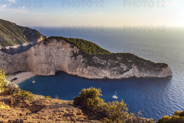 Greece. The magical island of Zakynthos. The cove with a small sandy beach. The famous rusty ship, Navajo Bay (Navagio Beach). The concept of a summer beach holiday and photo tourism