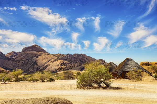 Africa. Namibia. Spitzkoppe is a small picturesque rock massif in Namibia. Magnificent stone red-orange remains of Spitzkoppe from coarse-grained granite