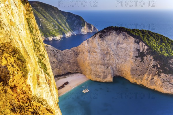 Famous Shipwreck Beach. Romantic fabulous sunset. The picturesque coast of the Greek island of Zakynthos. The concept of active, ecological and photo tourism