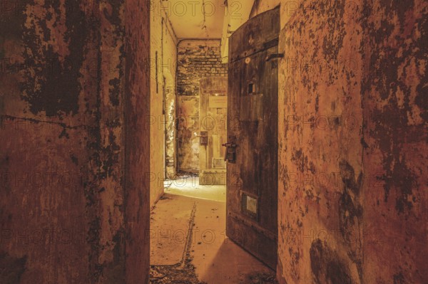 Dilapidated corridor with open doors and rusty walls, gloomy and mysterious, Prison H11, Lost Place, Verviers, Province of Liège, Belgium, Europe