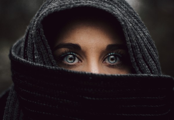 Portrait close up of veiled muslim blue eyed young girl