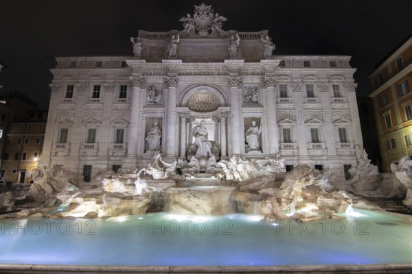 The Trevi Fountain, one o'clock in the morning at the blue hour. No people, but well lit. Monumental fountain on the Piazza di Trevi in front of Palazzo Poli. Fontana di Trevi, Rome, Italy, Europe