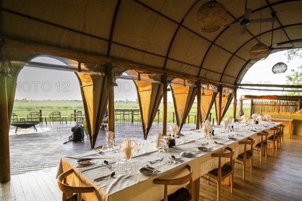 Set table in the restaurant, Okuti Camp, Moremi Game Reserve, Okavango Delta, Maun, Botswana, Africa
