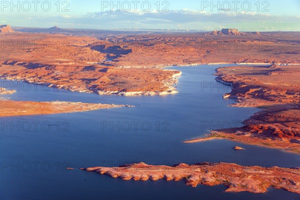Lake Powell is a reservoir on the Colorado River. States of Utah and Arizona. USA. Huge lake of artificial origin among the red sandstone cliffs. The photos were taken from the plane