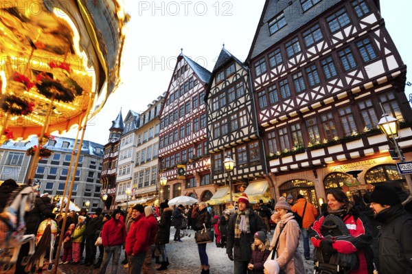 Christmas market, carousel and half-timbered houses at the Römer, Römerberg, Old Town, Frankfurt am Main, Hesse, Germany, Europe