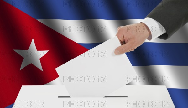 The Cuban flag and the hand with the bulletin about the ballot box