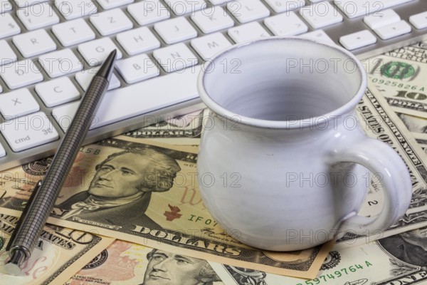 Business desk - Empty cup of tea, luxury pencil and keyboard