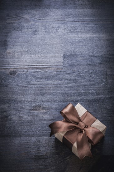 Beaul present box-container on vintage wood board holiday concept